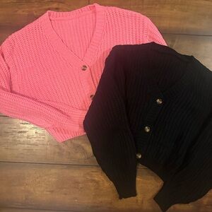 Two cropped sweaters from the TikTok shop, one pink one black size medium